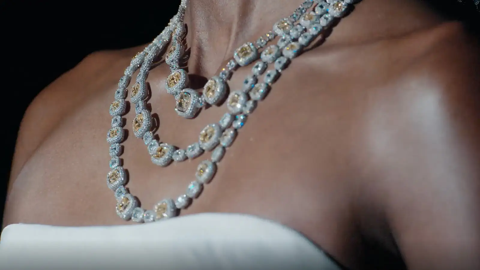 Close up on the necklace worn by a model