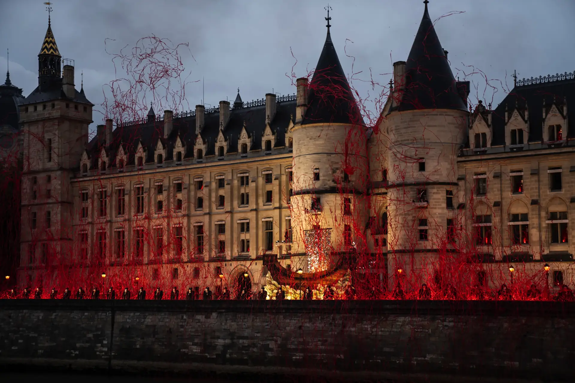 Conciergerie Palace covered in red smoke from the show performed by Gojira during the ceremony