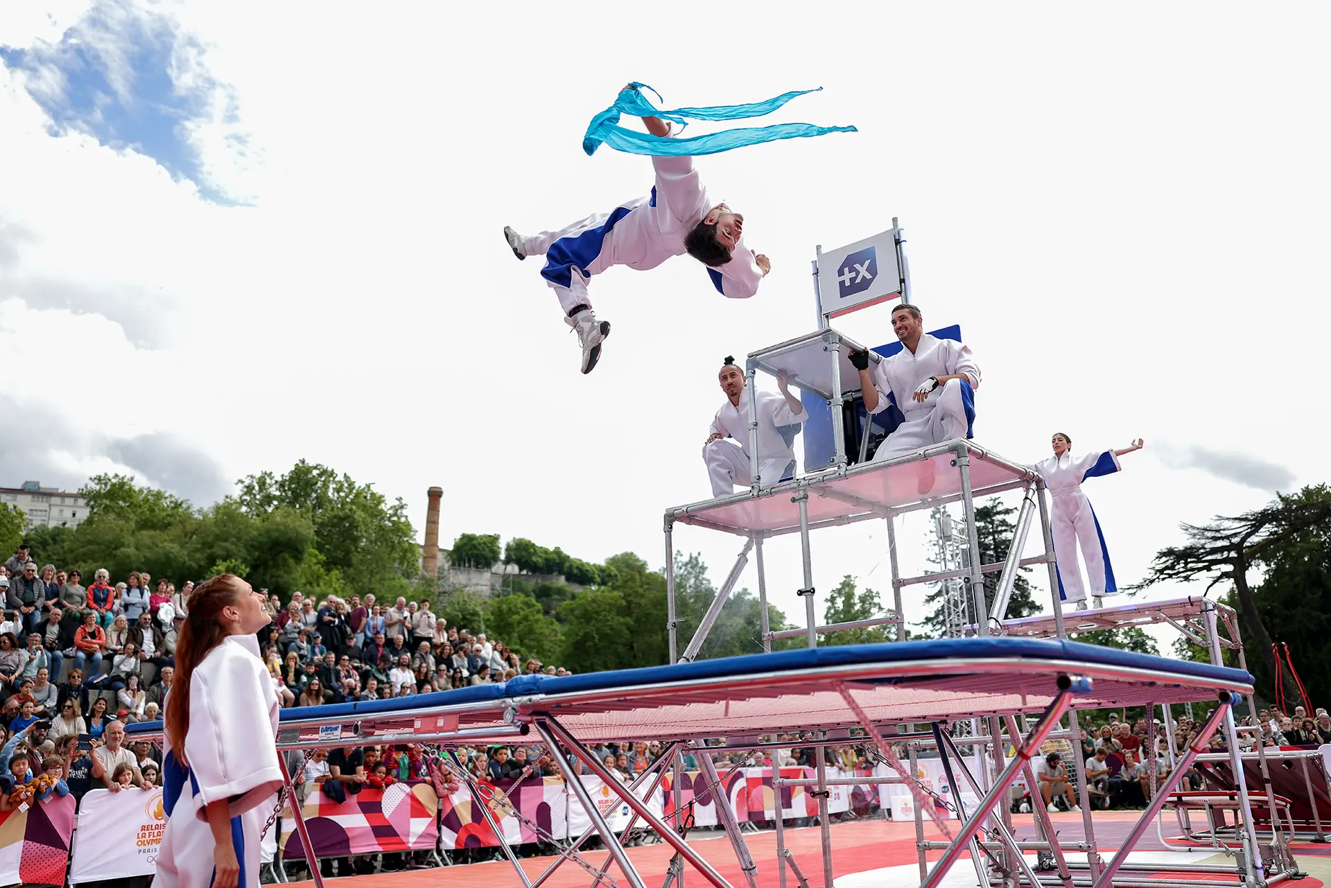 Performers jumping on a trampoline during an activation