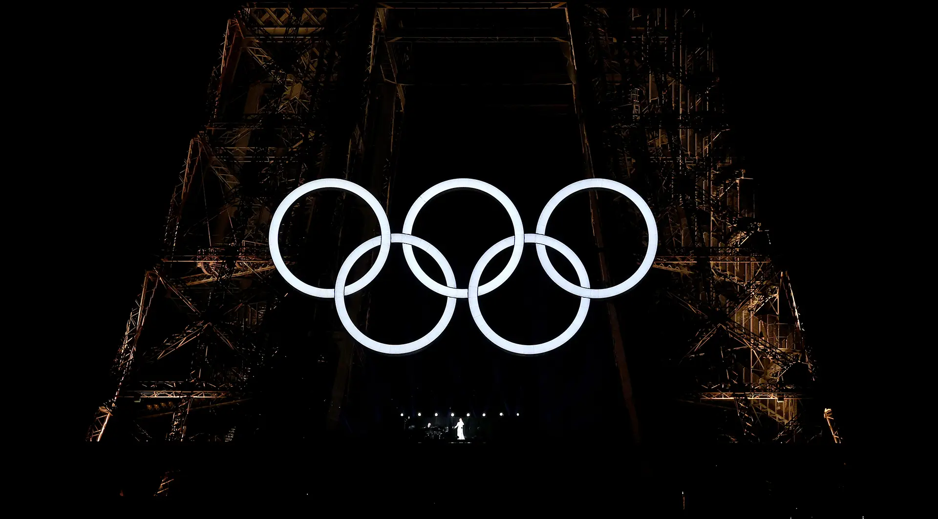 Celine Dion singing under the Olympic rings on the Eiffel Tower
