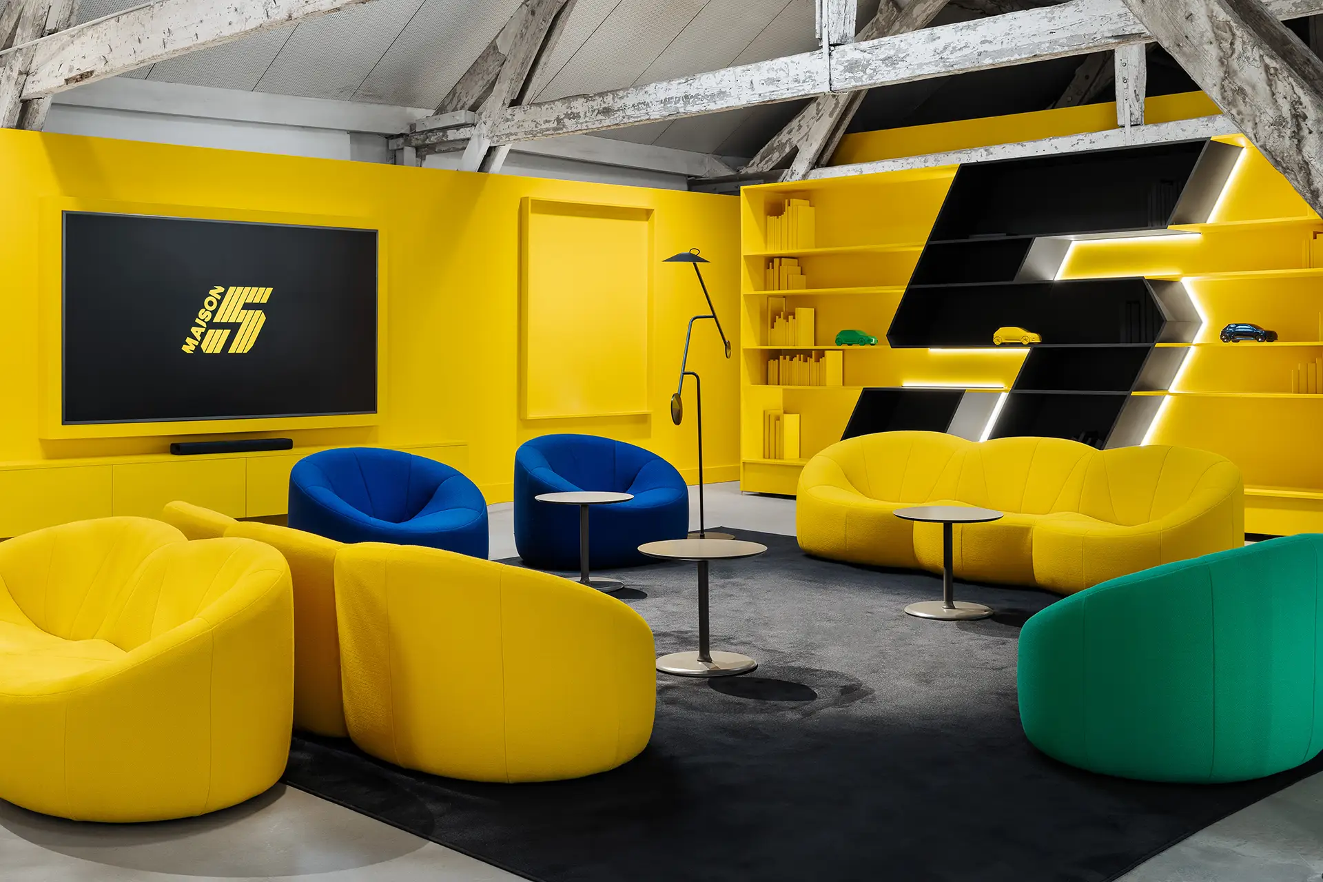 Lounge area, yellow branding, R5 logo