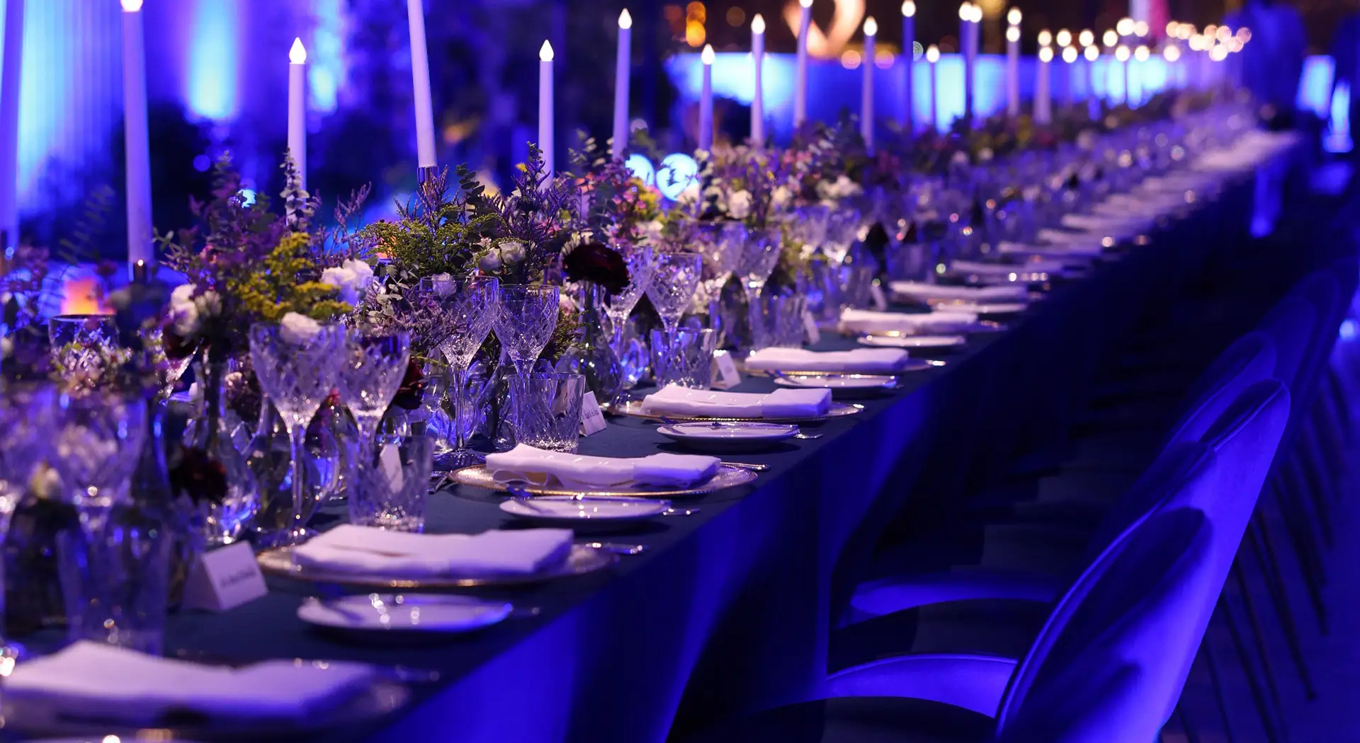 Photo of the tables during the dinner, with candles and exquisite tableware