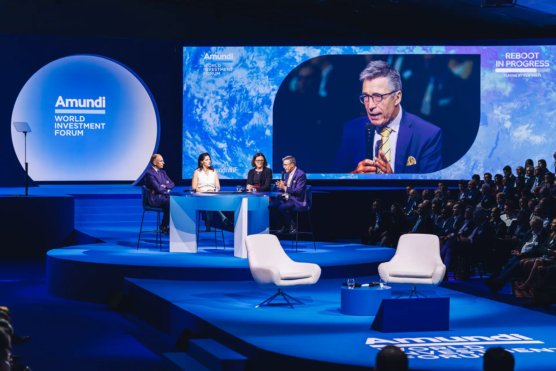 Panelists discussing on the main stage at Amundi World Investment Forum