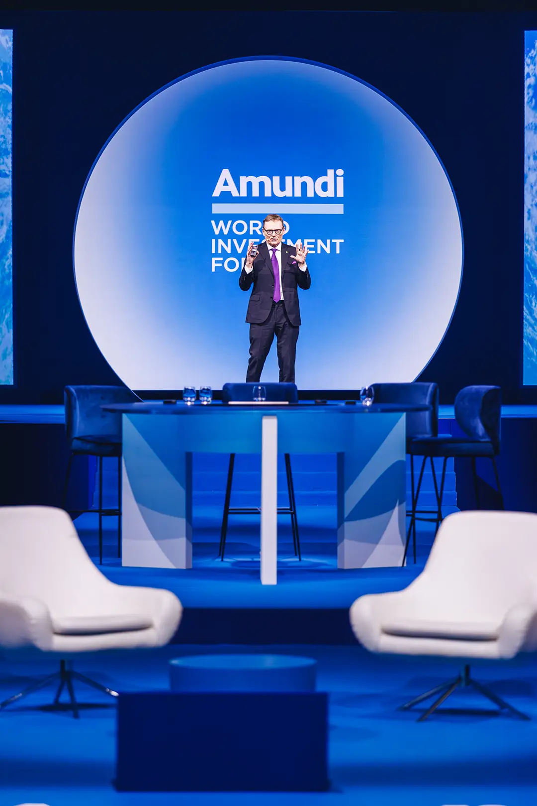 Speaker on the main stage, blue lighting