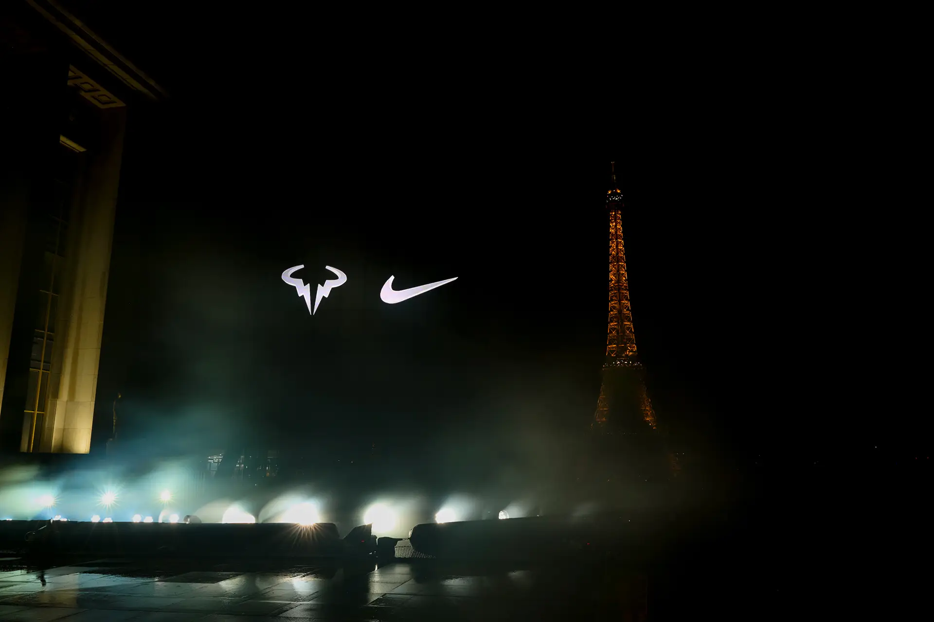 Holographic display of Nike branding, in the night sky of Paris, Eiffel Tower in background