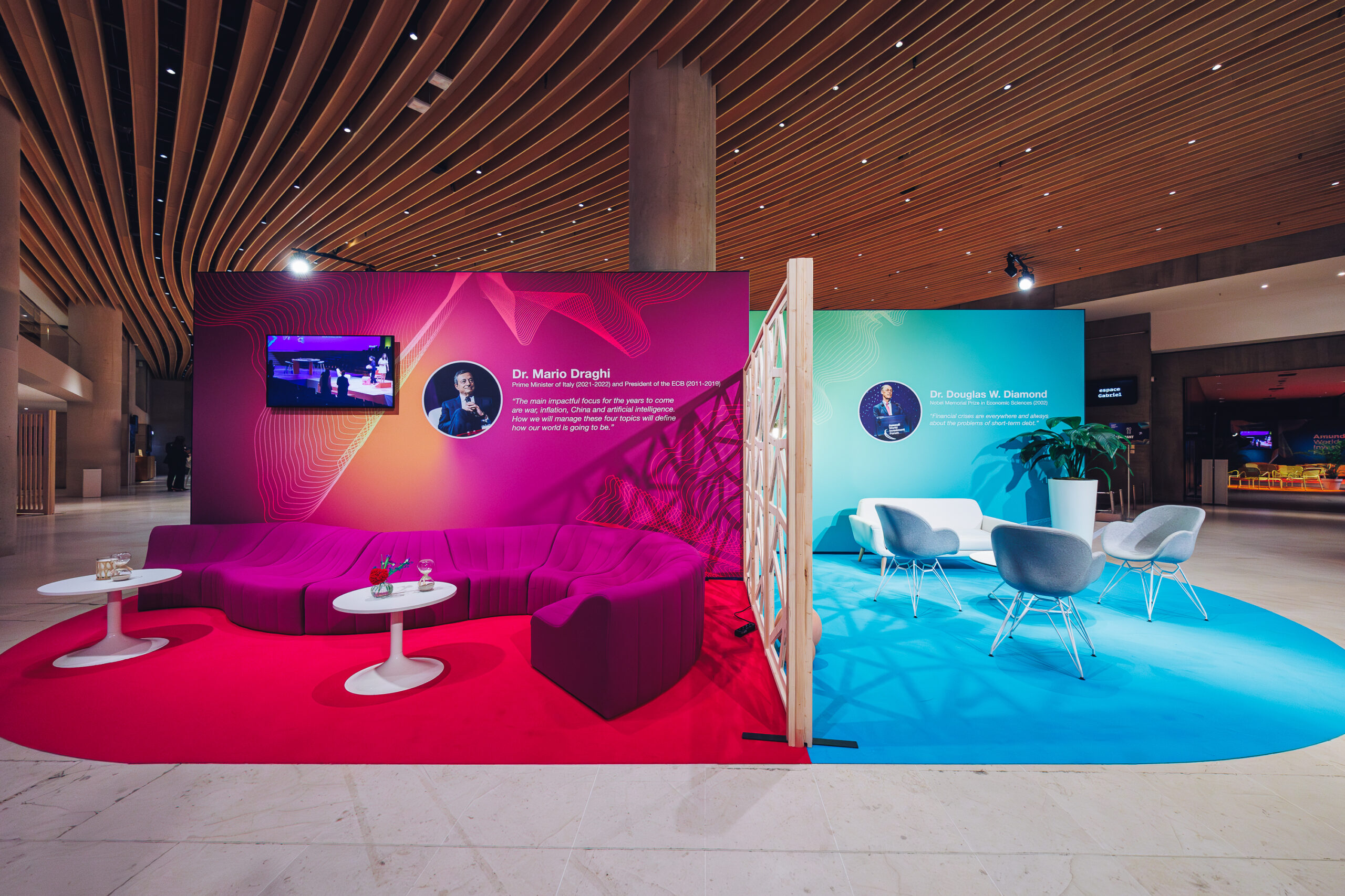 Colorful booths visible in the networking area