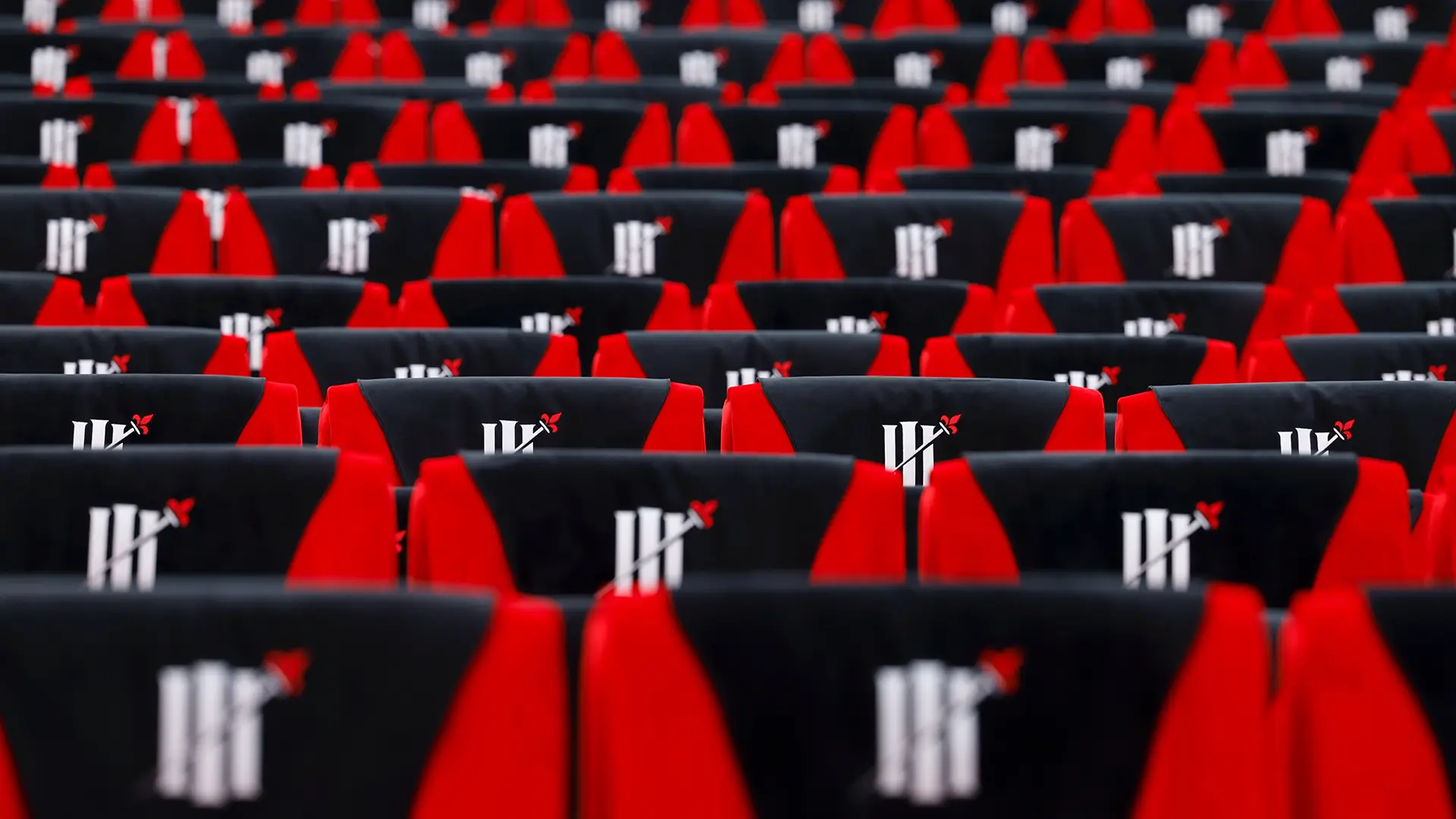 Details of the movie theater chairs, with the Three Musketeers' branding